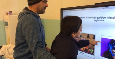 Francesco with Mr David answering questions about carnival.