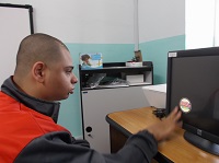 Isaac using his finger to touch the object on screen.