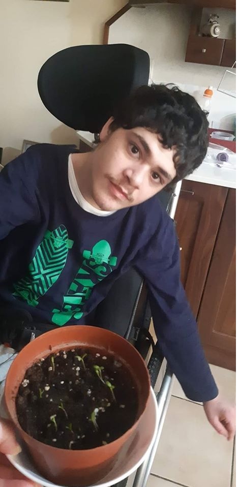 Photo of Zachary with the Tall Mirigold Seed