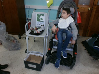 The student weighing recycled material