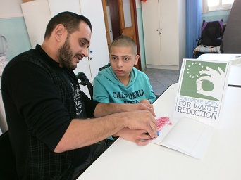 Isaac sponge painting the slogan  