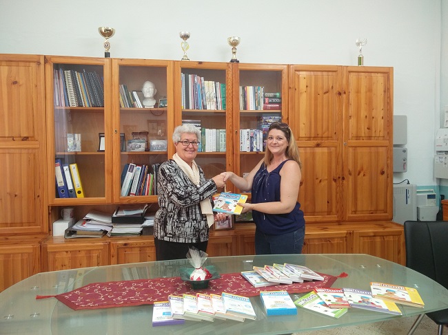 RS Group donating several sets of books.