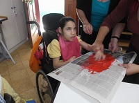 Nina exploring paint..